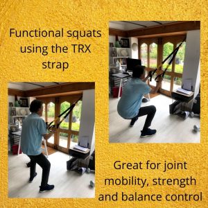 Functional squats using the TRX strap